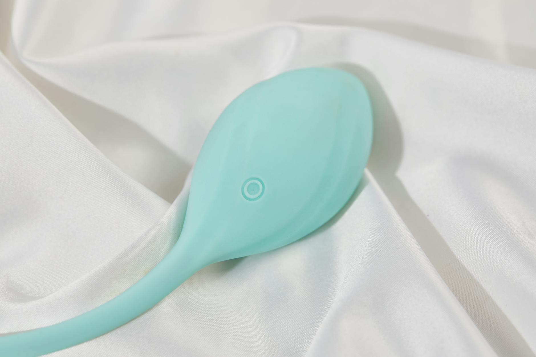 Lemon clitoral vibrator on white silk, representing the restoration of touch sensitivity