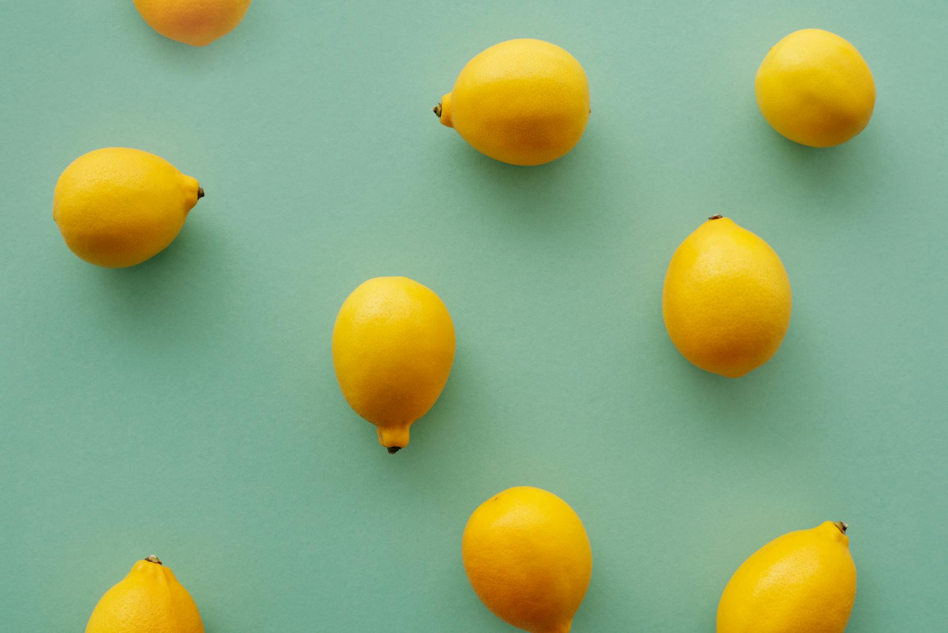 Colorful clitoral vibrators displayed on a bright yellow background